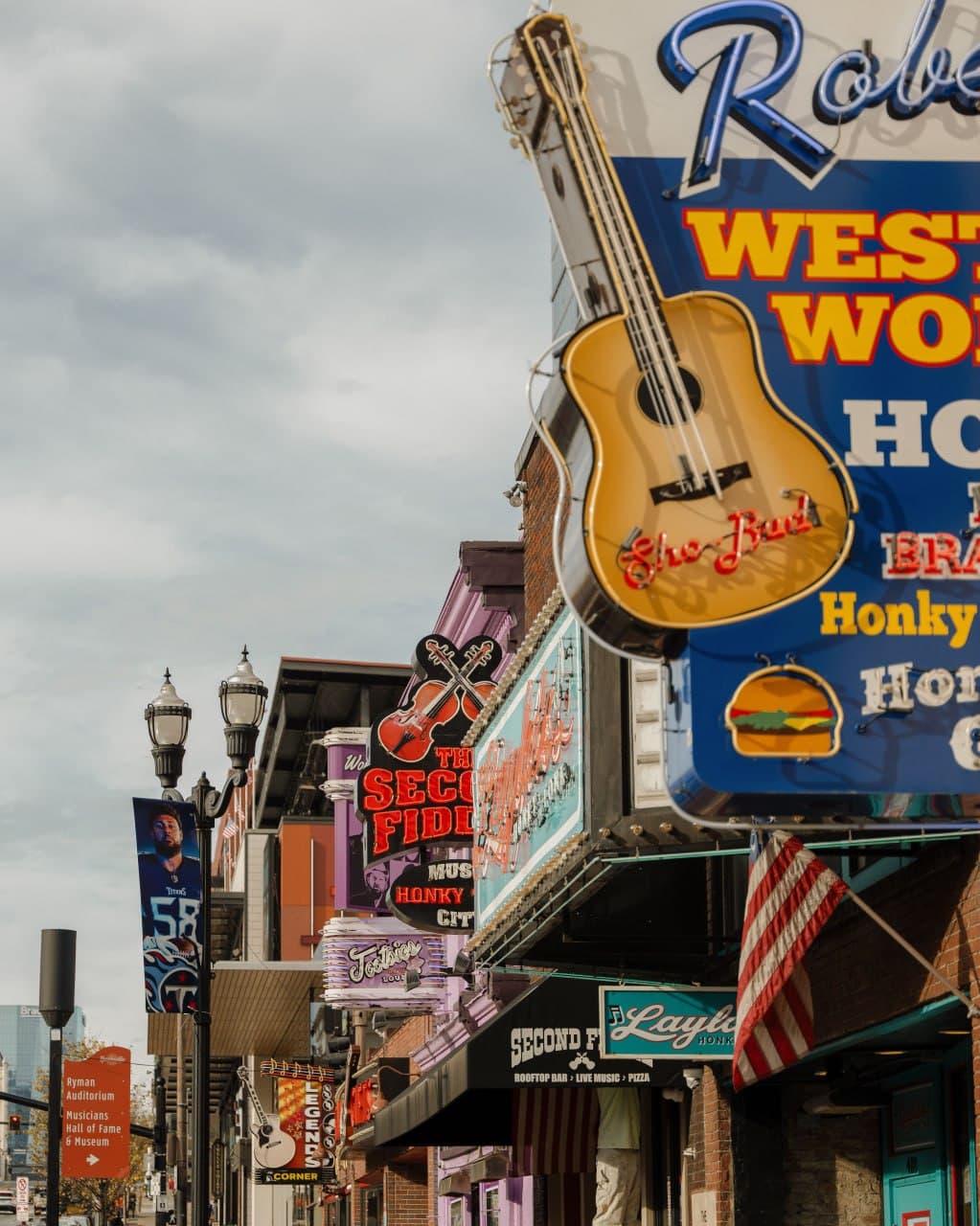 Colorful honky-tonk signs and guitar marquees on Broadway in Nashville