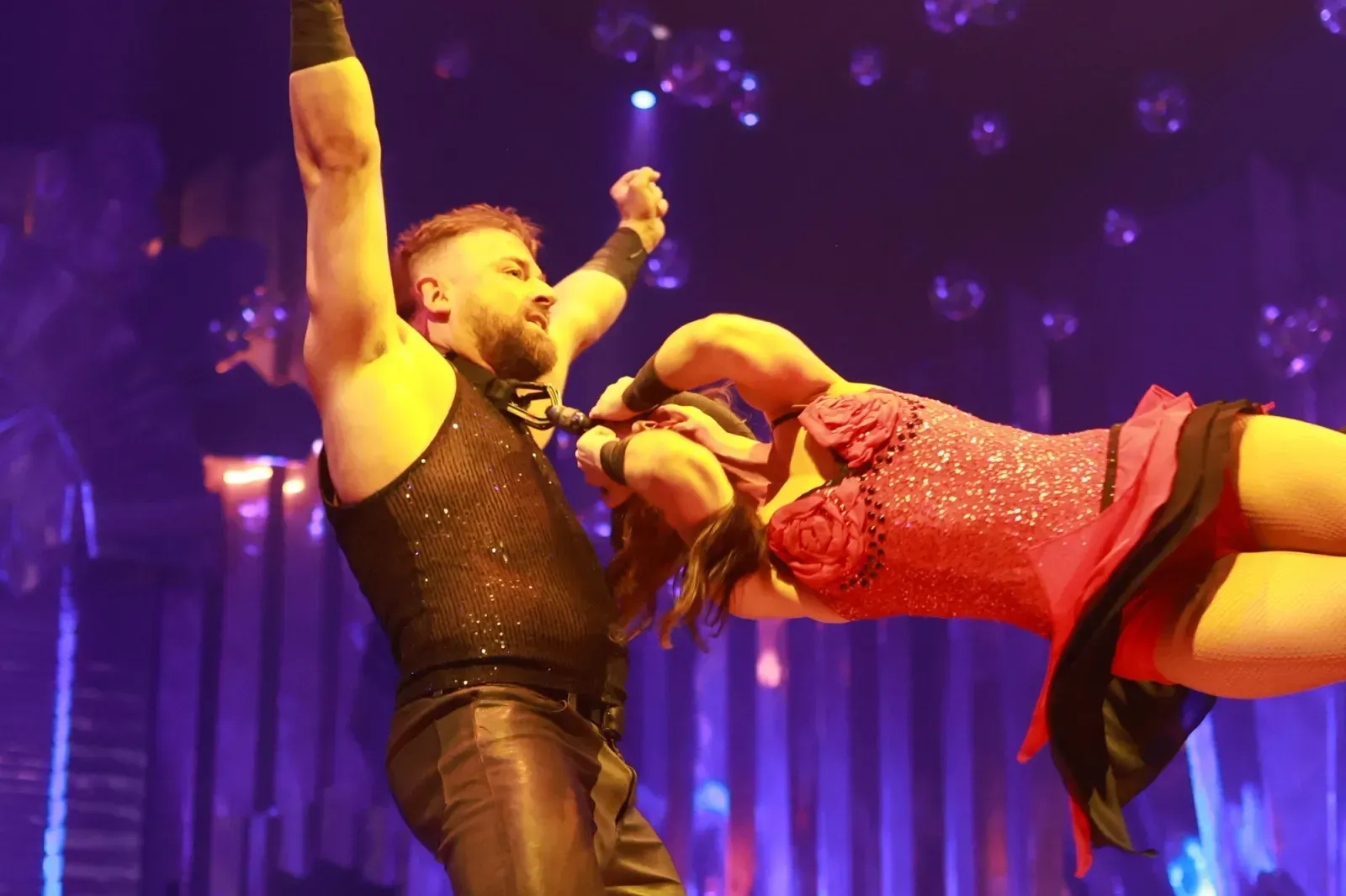 Performer on stage at a Bitcoin Conference after-party